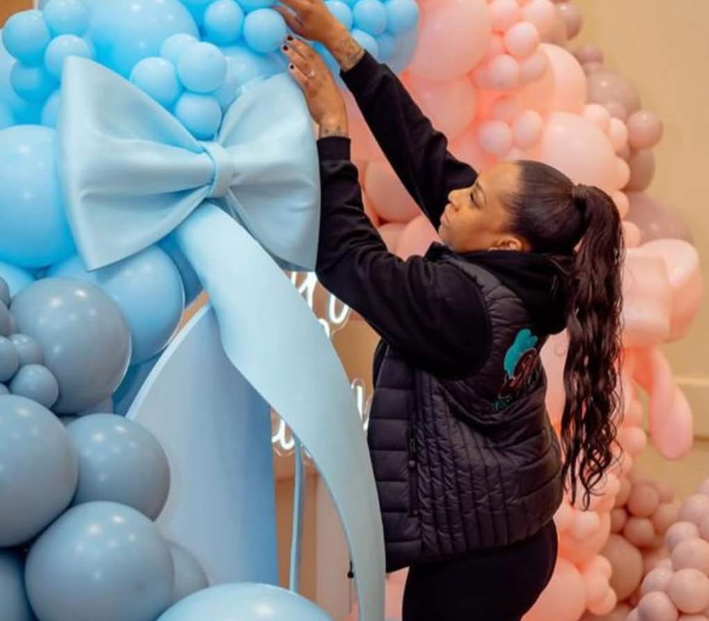 Khali Events owner creating party hire custom baby shower balloon display in South London